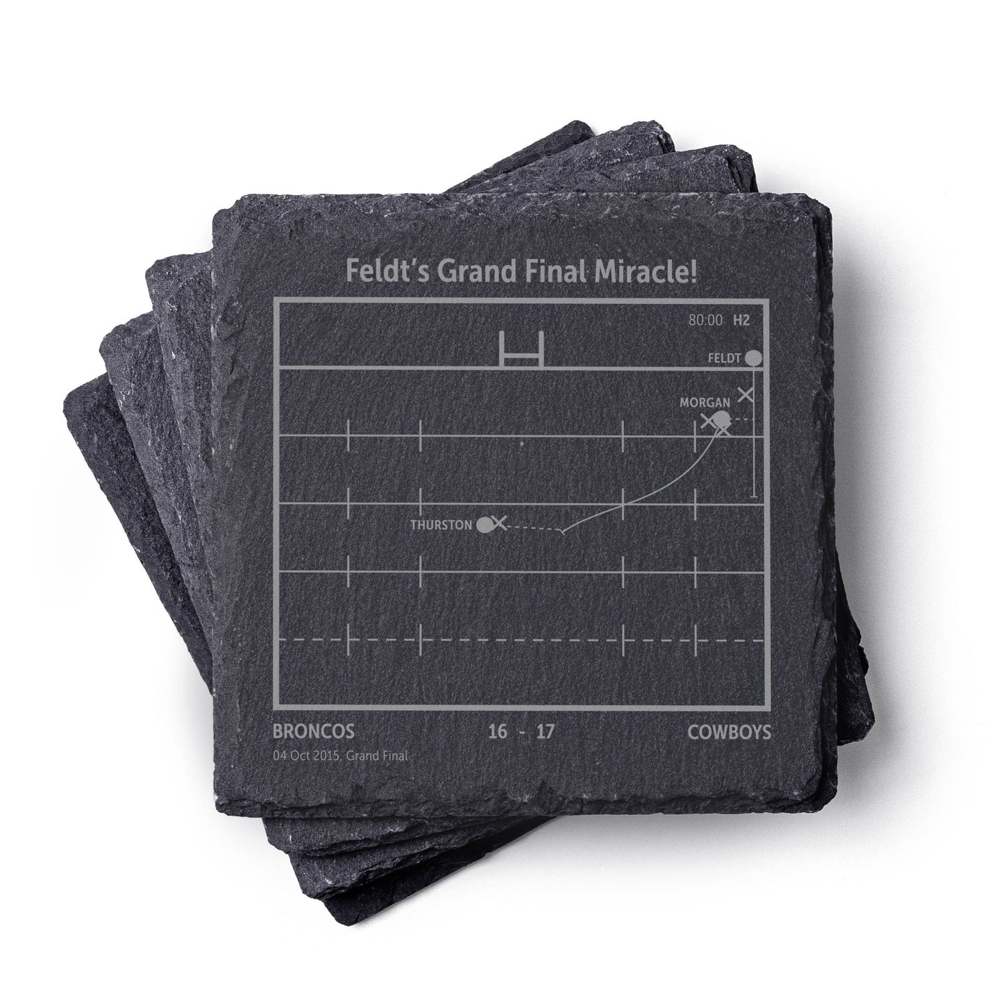 Stack of NQLD Cowboys NRL slate coasters with engraved playbook sports design and text on a white background